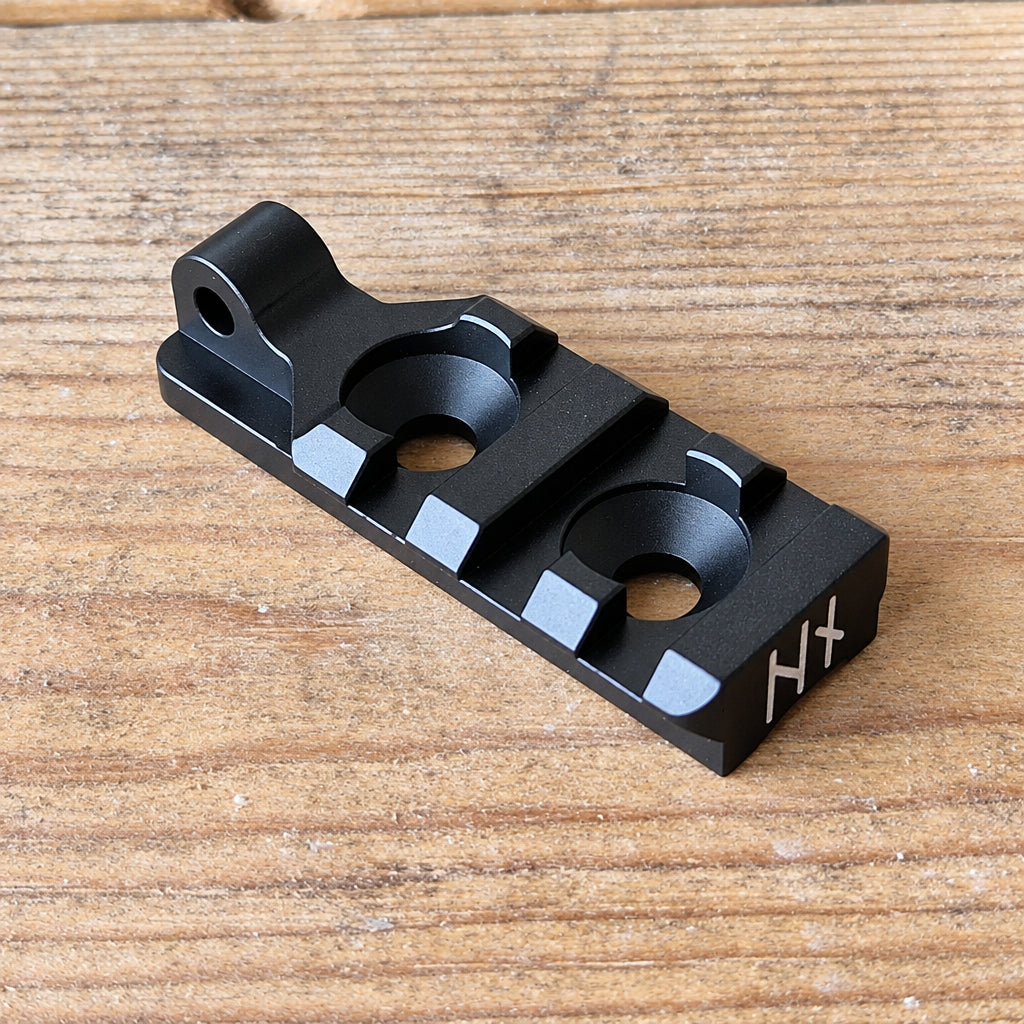 NorneHunt Standard Mini Picatinny rail showing its two mounting holes and sling attachment point.