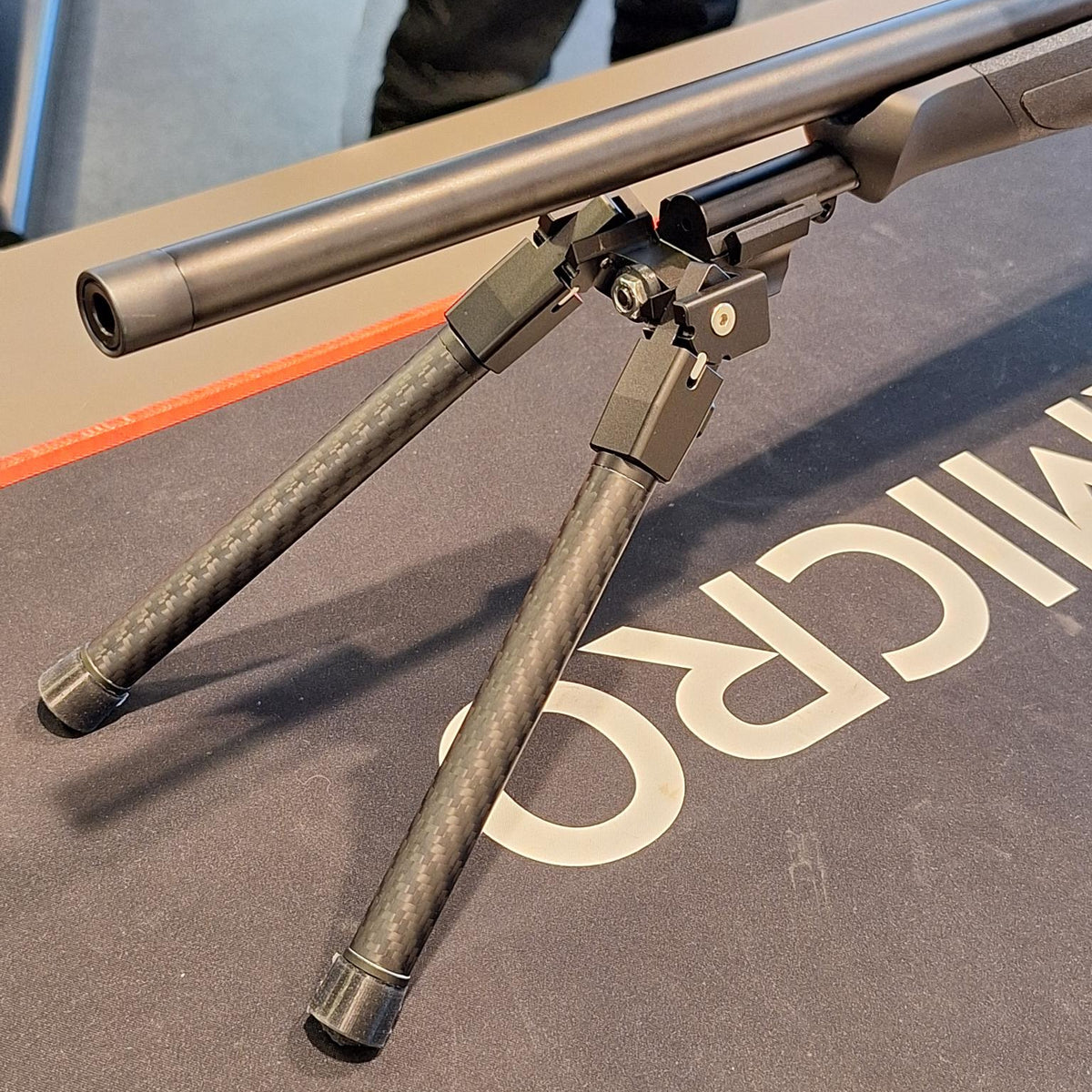 Sauer rifle supported by a bipod mounted on the Sauer 404/505 Picatinny adapter